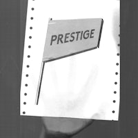 a black and white photo of a flag with the word prestige on it