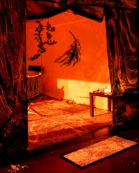 a room with a bed and curtains